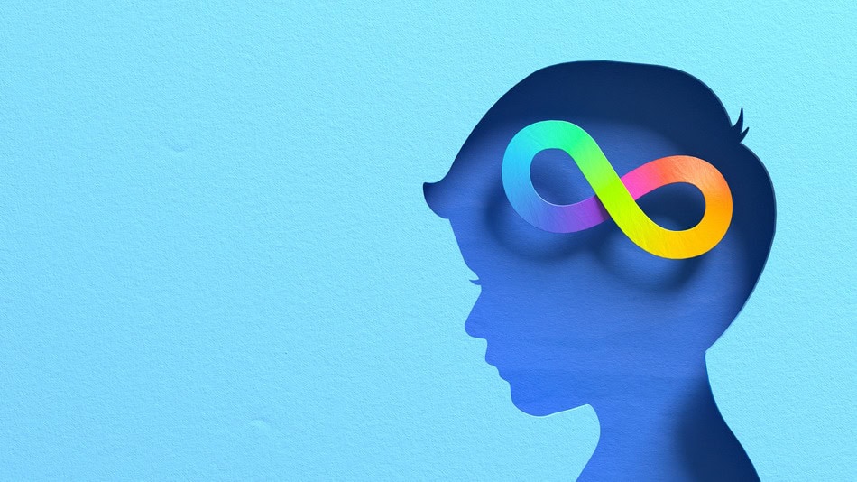 Silueta de cabeza de ni&ntilde;o azul con s&iacute;mbolo de infinito colorido que representa neurodiversidad, autismo